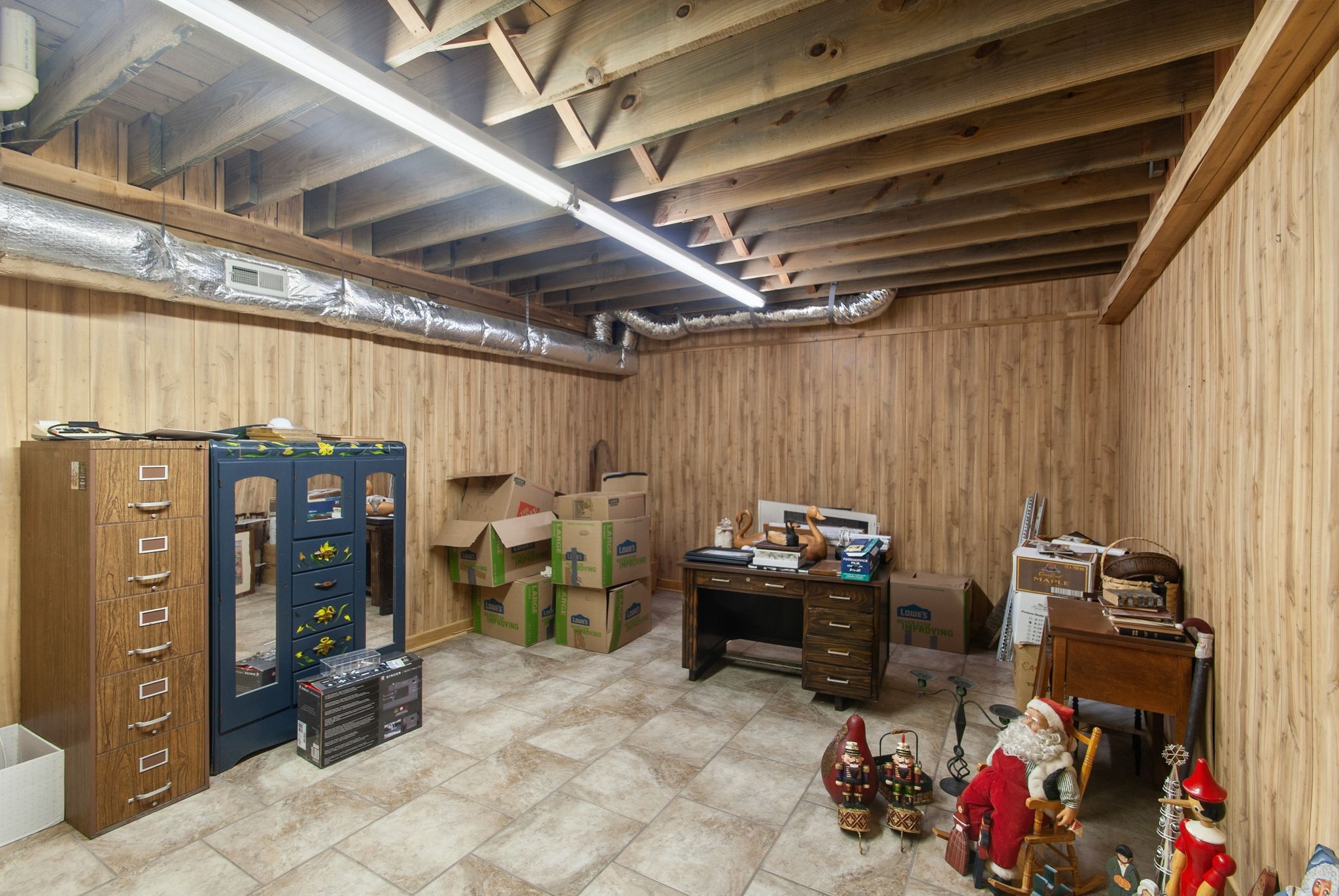 1927 Fowler Hollow Road Lynnville, TN 38472 - Photo 40 of 77 a view of a storage room with water heater and racks
