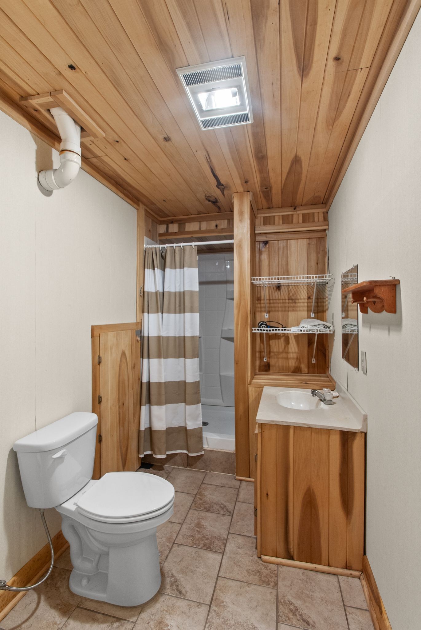 1927 Fowler Hollow Road Lynnville, TN 38472 - Photo 42 of 77 a bathroom with a granite countertop sink a toilet and shower