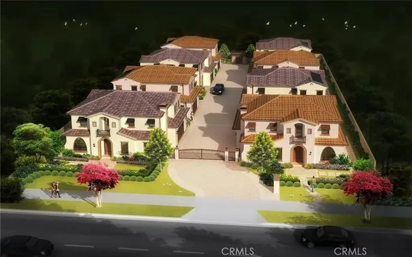 an aerial view of residential houses with outdoor space