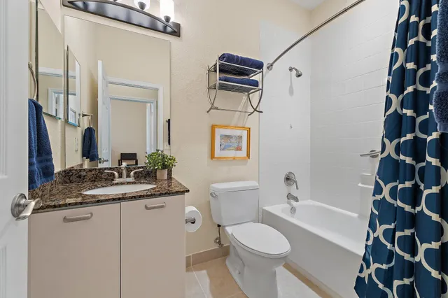 a room with furniture a chandelier and a window