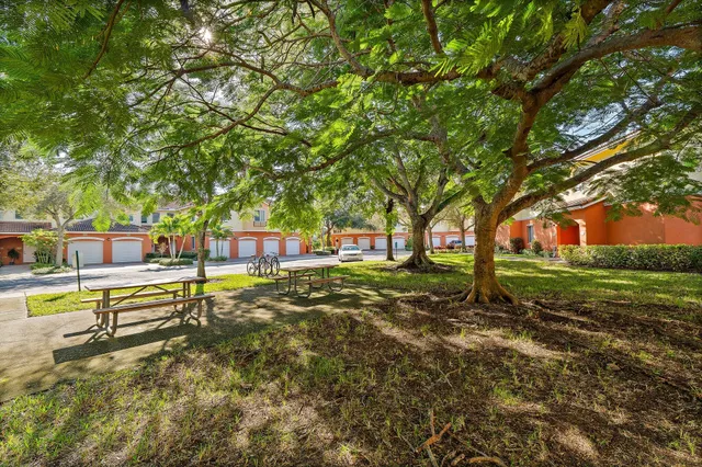 a view of a dining room with a table and chairs