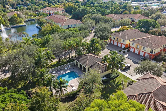an aerial view of residential houses with outdoor space