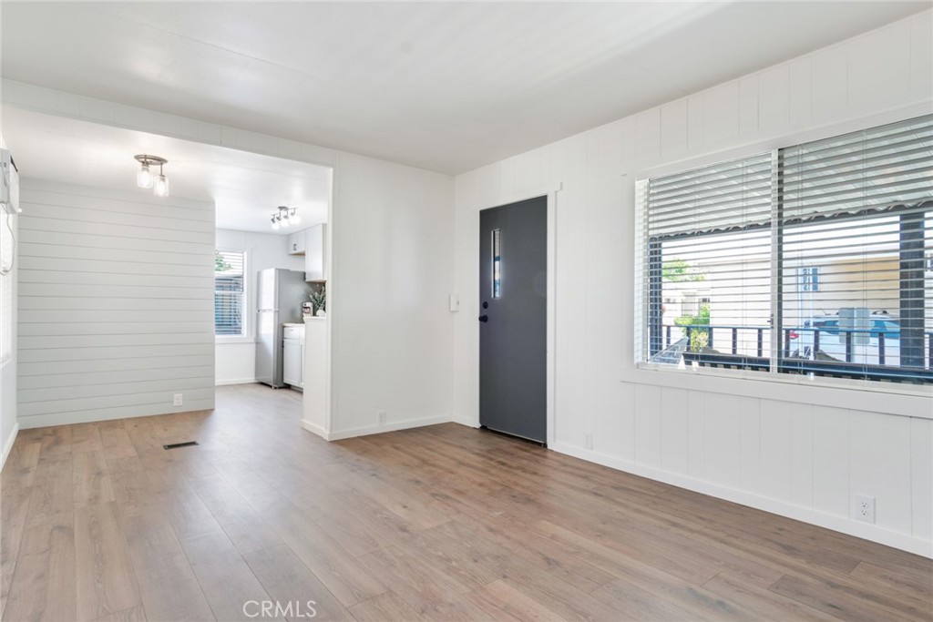 975 California Street, Unit 72 Calimesa, CA 92320 - Photo 10 of 23 a view of a room with wooden floor and windows