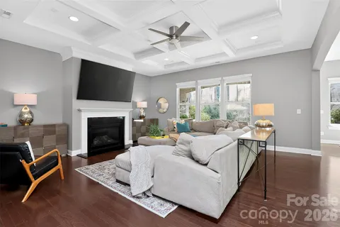 a living room with furniture fireplace and a flat screen tv