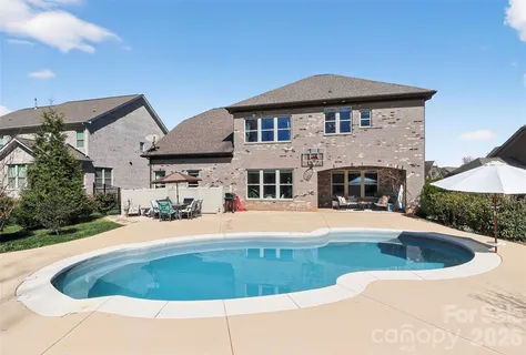a front view of a house with swimming pool