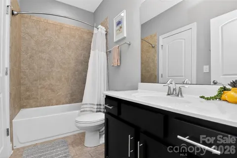 a bathroom with a sink a toilet and a bathtub
