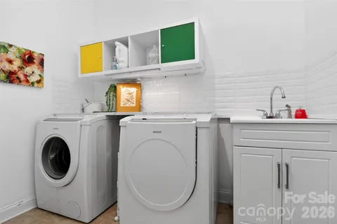 a utility room with dryer and washer