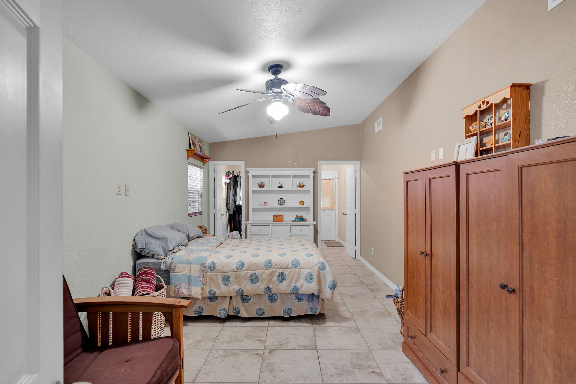 72 1st Court Key Largo, FL 33037 - Photo 11 of 30 a bedroom with a bed and a chandelier