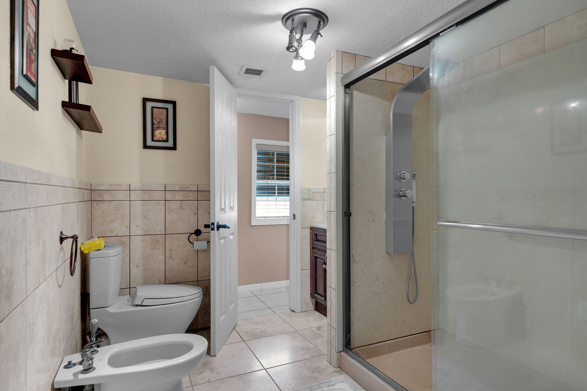 72 1st Court Key Largo, FL 33037 - Photo 16 of 30 a bathroom with a toilet and a shower