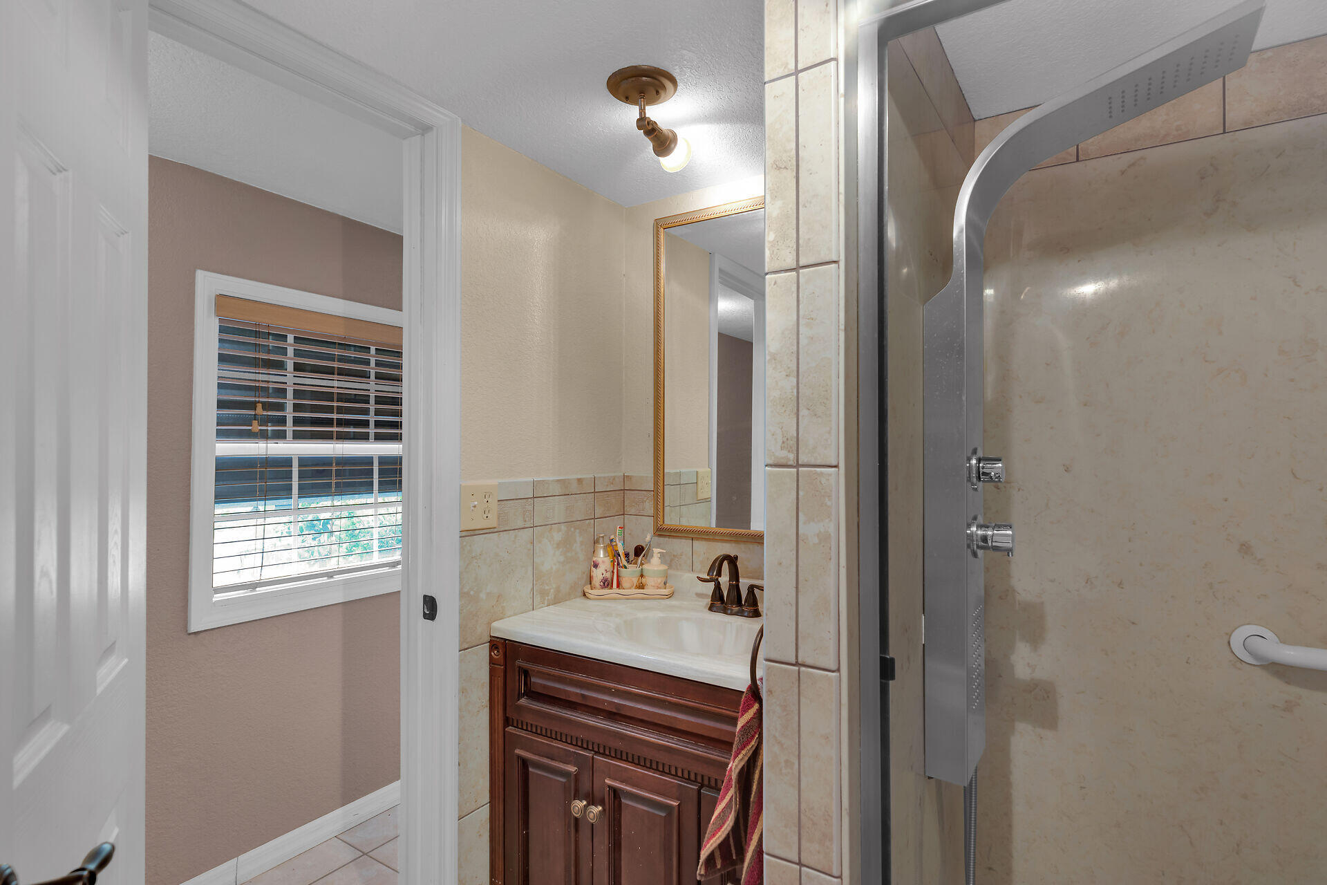72 1st Court Key Largo, FL 33037 - Photo 17 of 30 a bathroom with a sink a vanity and a mirror