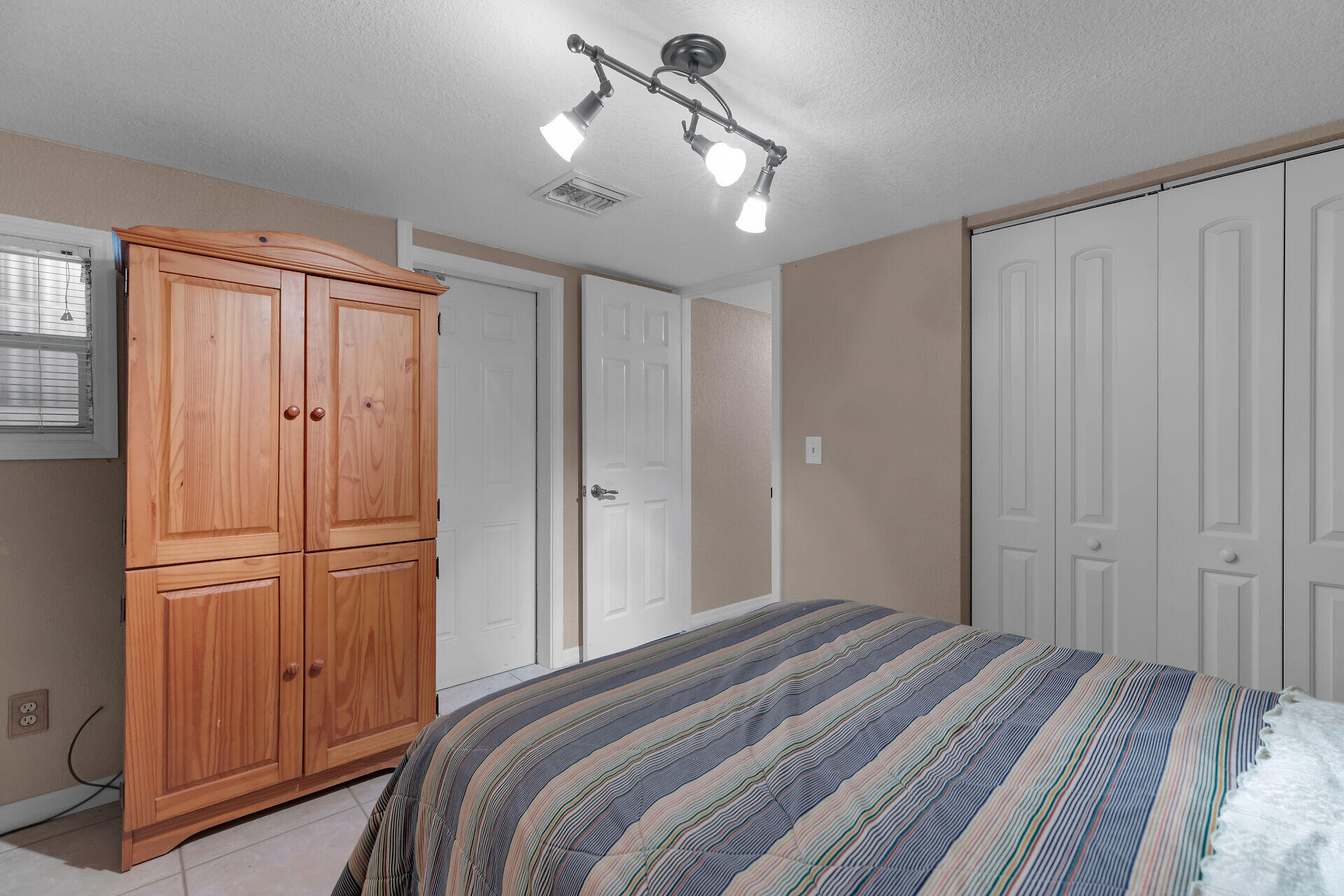 72 1st Court Key Largo, FL 33037 - Photo 20 of 30 a bedroom with a bed and cabinets