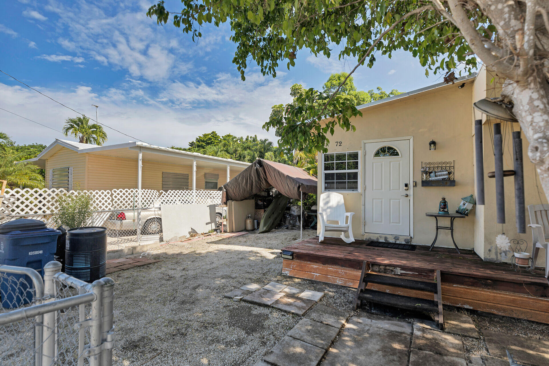 72 1st Court Key Largo, FL 33037 - Photo 2 of 30 a front view of a house with garden