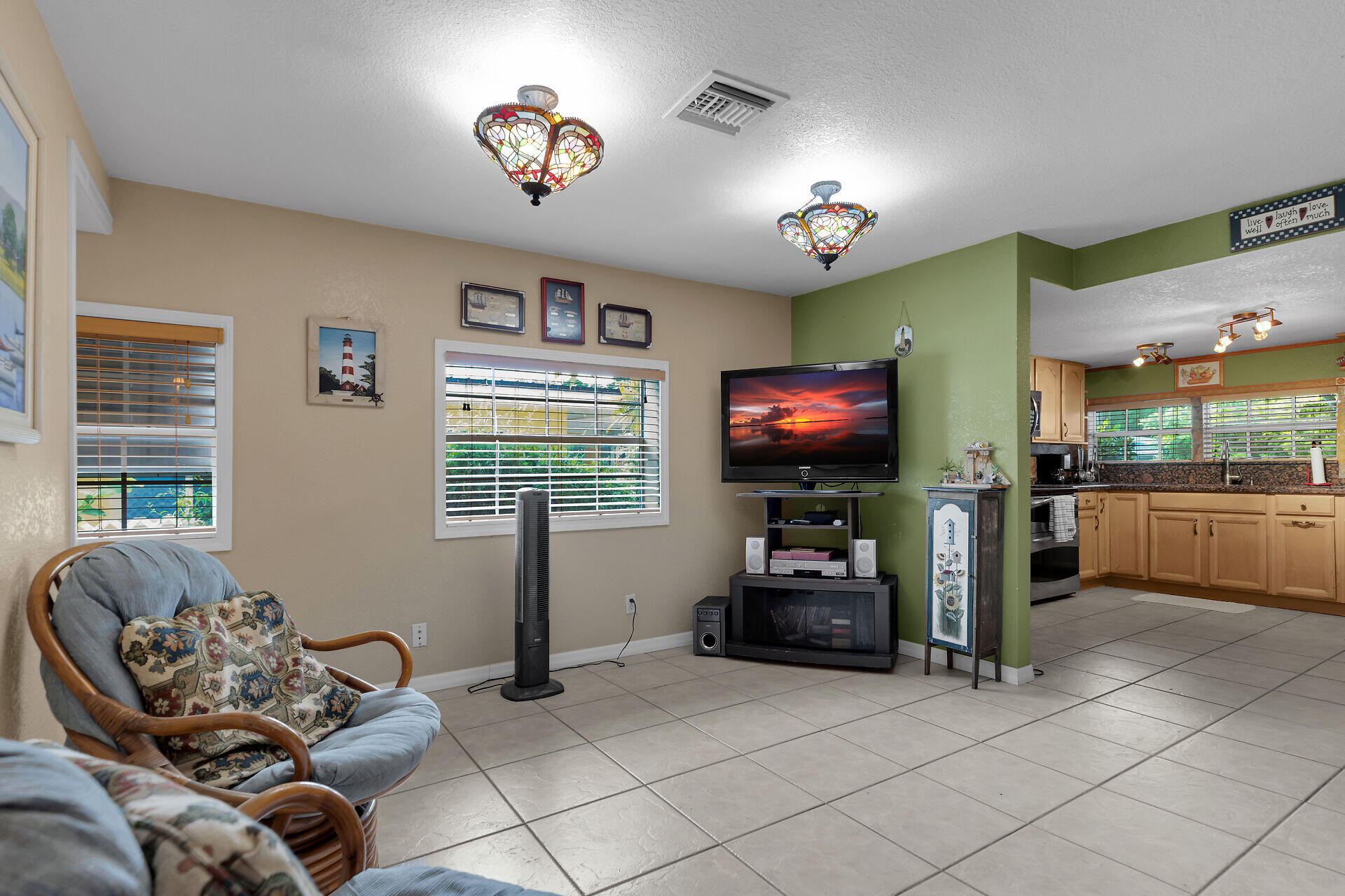 72 1st Court Key Largo, FL 33037 - Photo 6 of 30 a living room with furniture and a flat screen tv