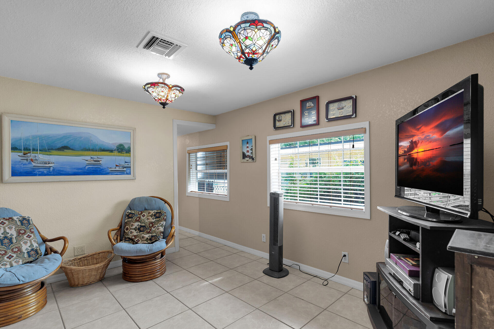 72 1st Court Key Largo, FL 33037 - Photo 9 of 30 a living room with furniture and a flat screen tv