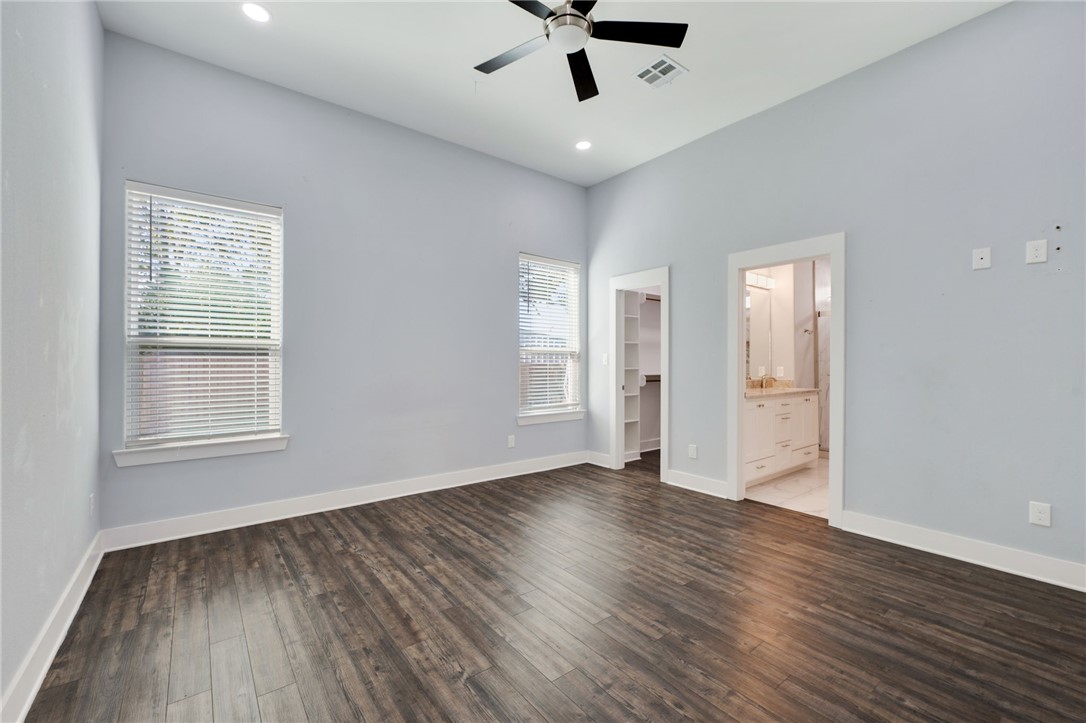 507 Walnut Street Bryan, TX 77803 - Photo 15 of 23 a view of an empty room with wooden floor and a window