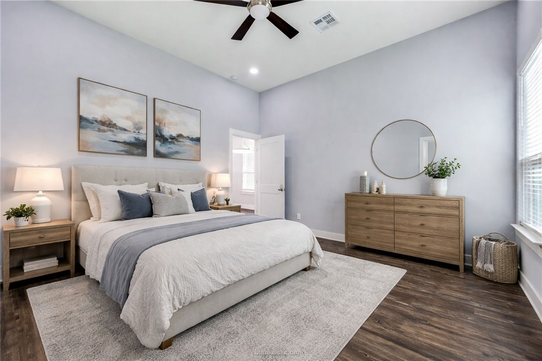 507 Walnut Street Bryan, TX 77803 - Photo 16 of 23 a bed room with a bed window and a table