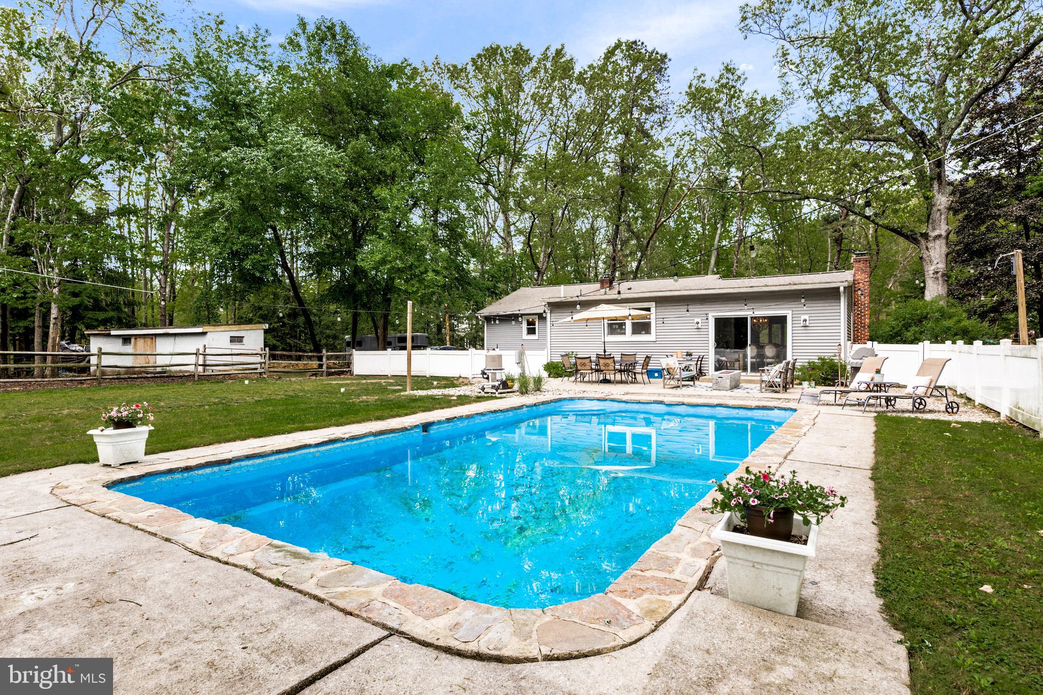 473 Stokes Road Shamong, NJ 08088 - Photo 29 of 49 a view of a house with swimming pool and sitting area