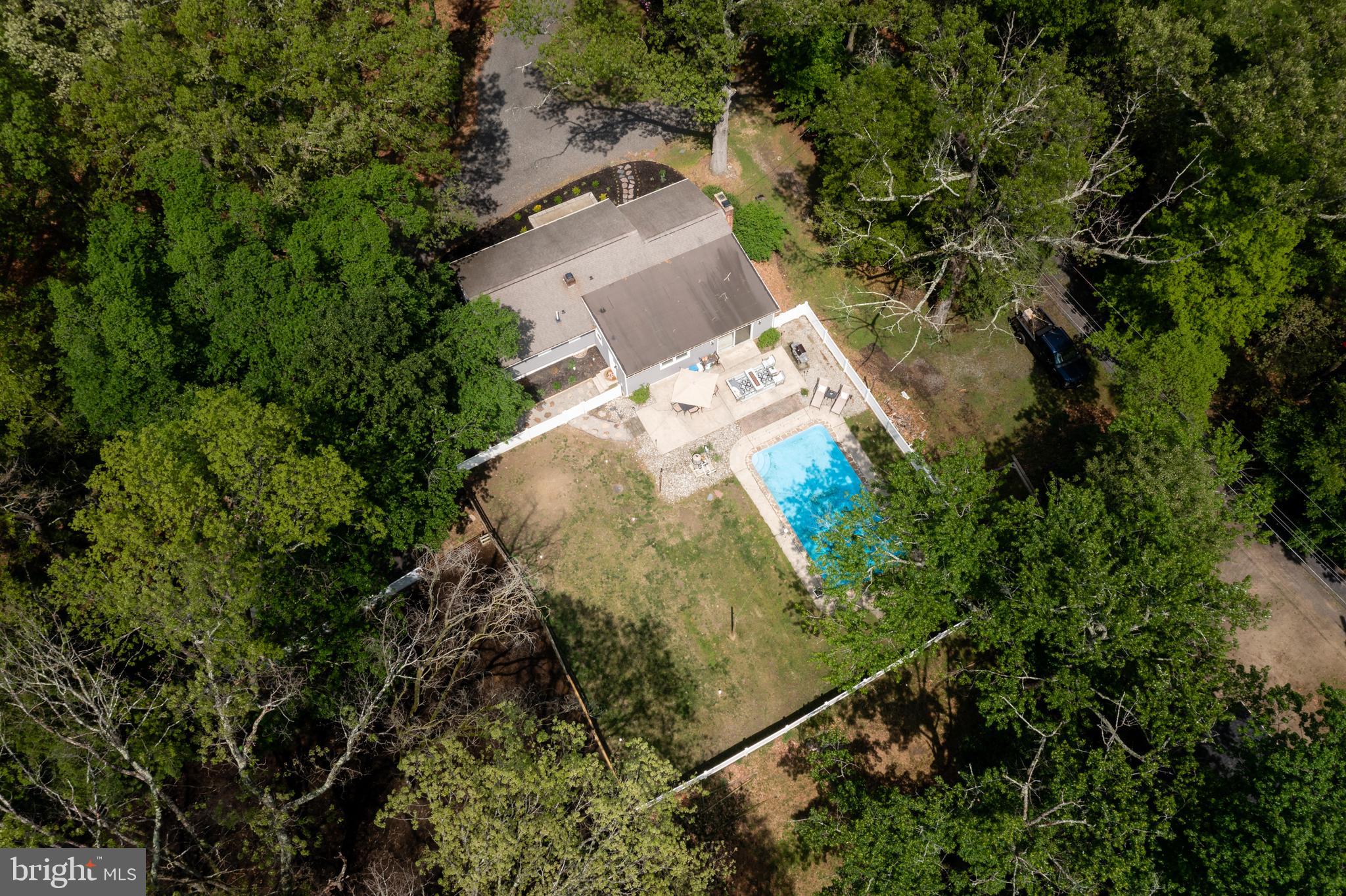 473 Stokes Road Shamong, NJ 08088 - Photo 45 of 49 an aerial view of a house with a yard and large trees