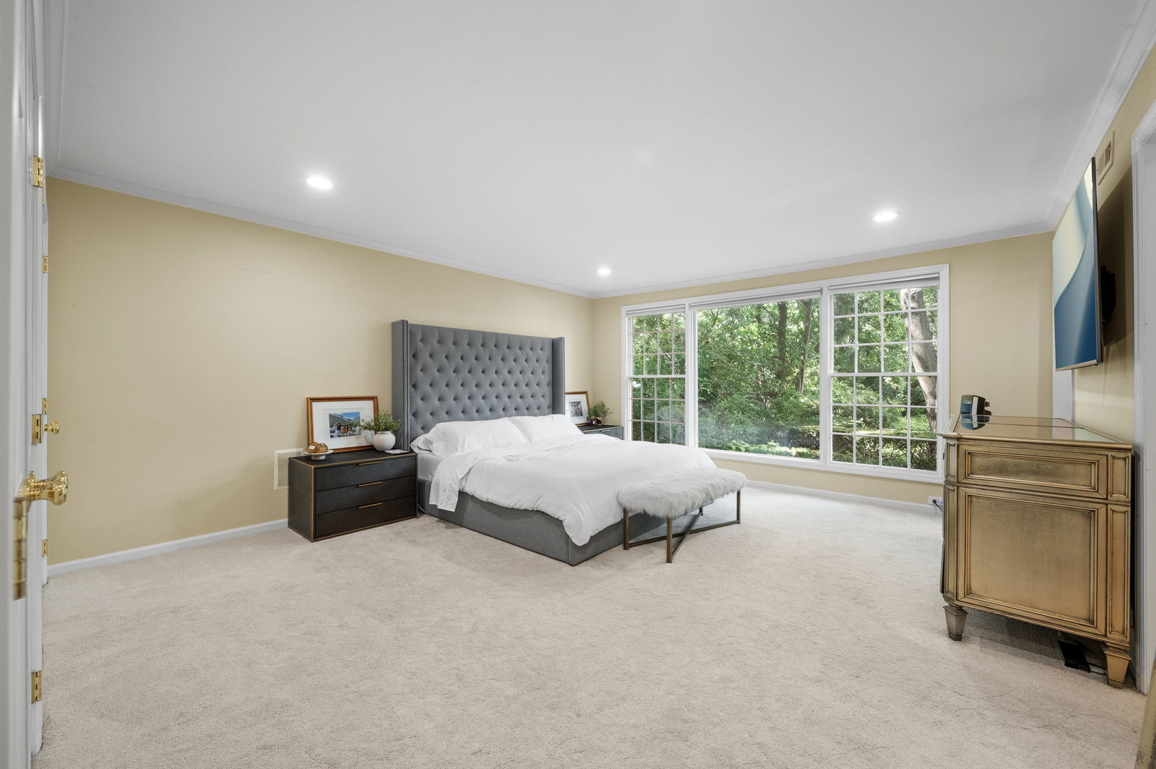 250 South Sheridan Road Lake Forest, IL 60045 - Photo 13 of 30 a spacious bedroom with a large bed and a flat tv screen on dresser