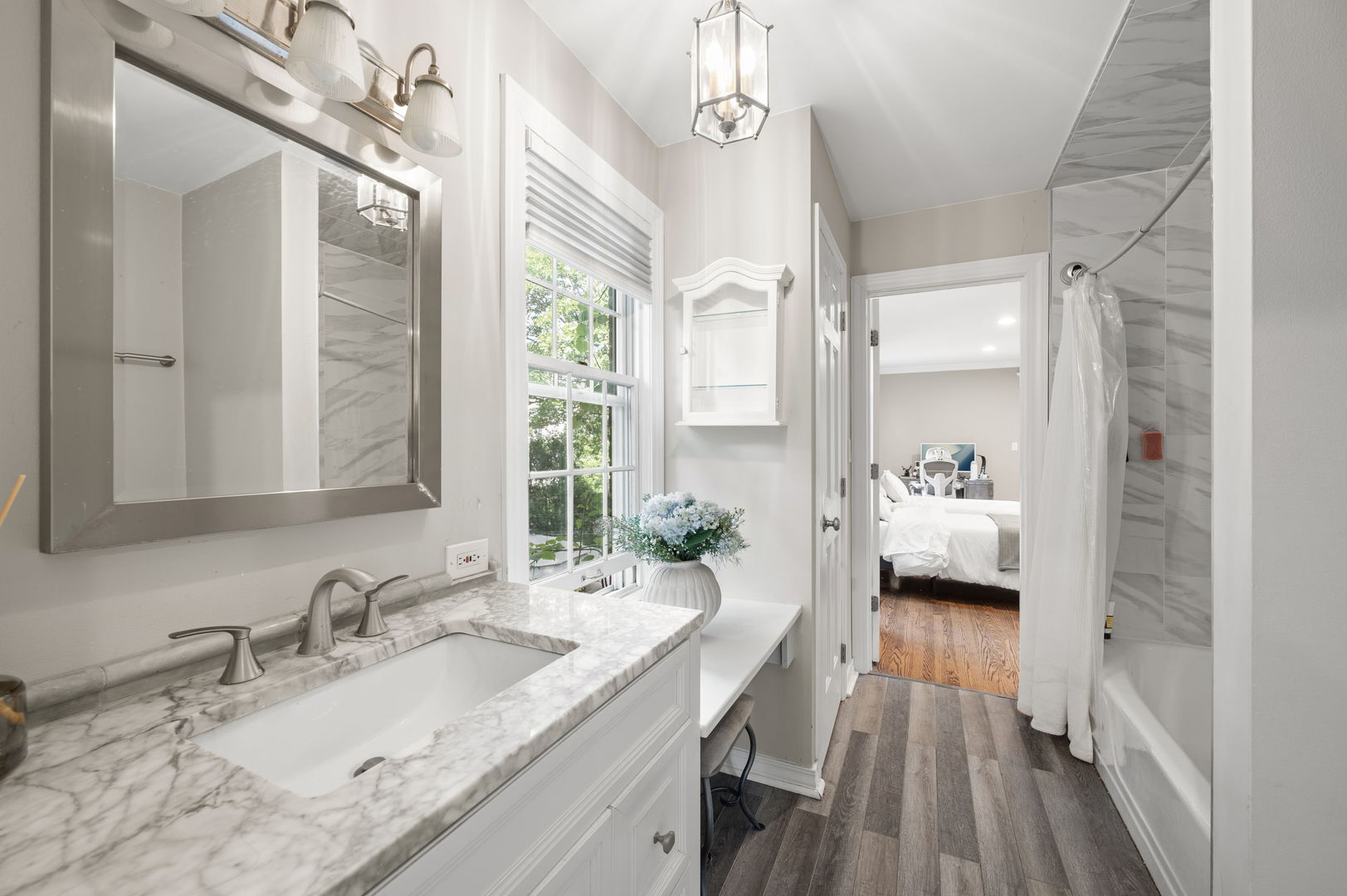 250 South Sheridan Road Lake Forest, IL 60045 - Photo 21 of 30 a en suite bathroom with a granite countertop double vanity sink a mirror and a shower