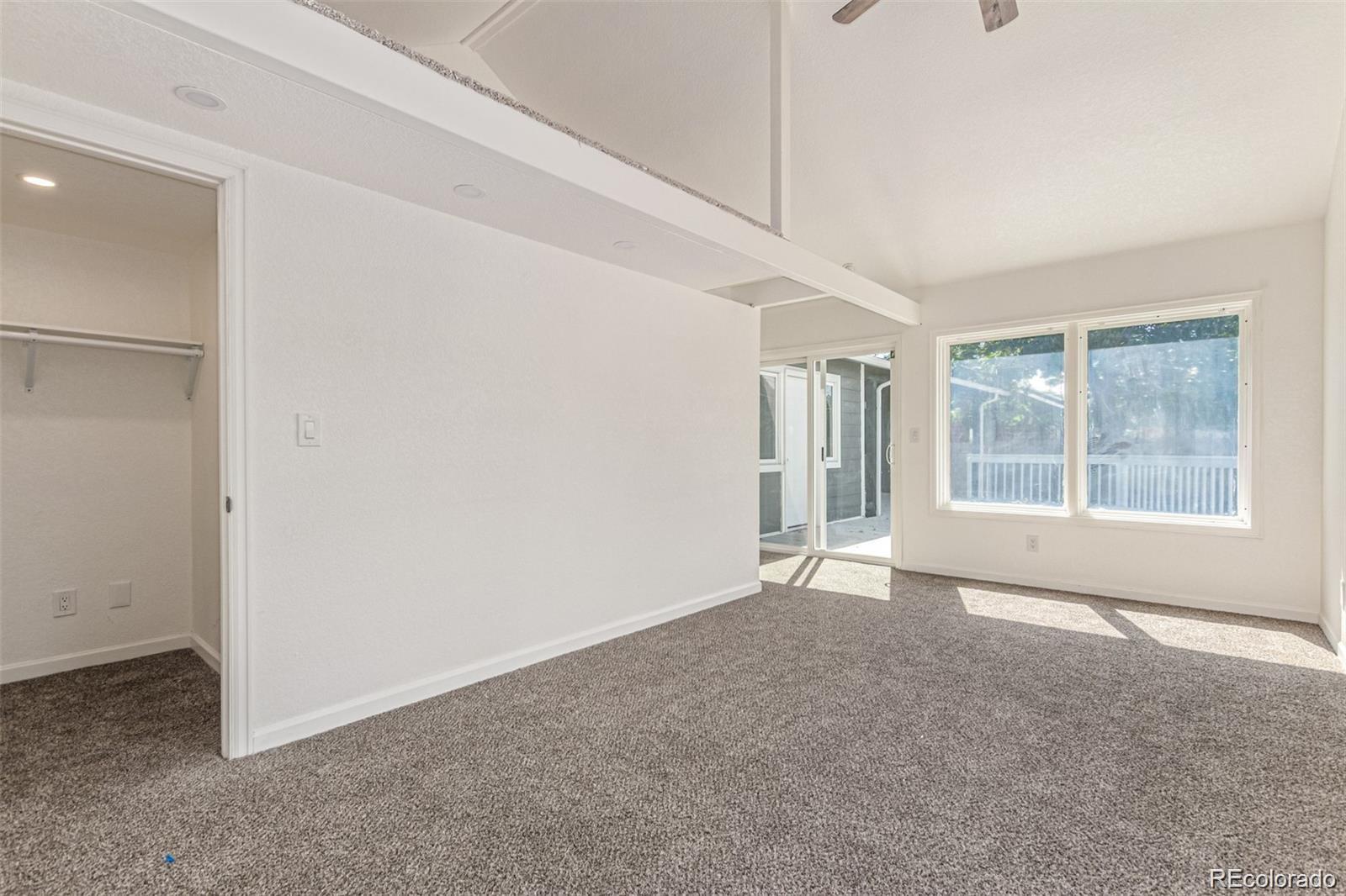 9495 Webster Way Broomfield, CO 80021 - Photo 20 of 32 an empty room with windows