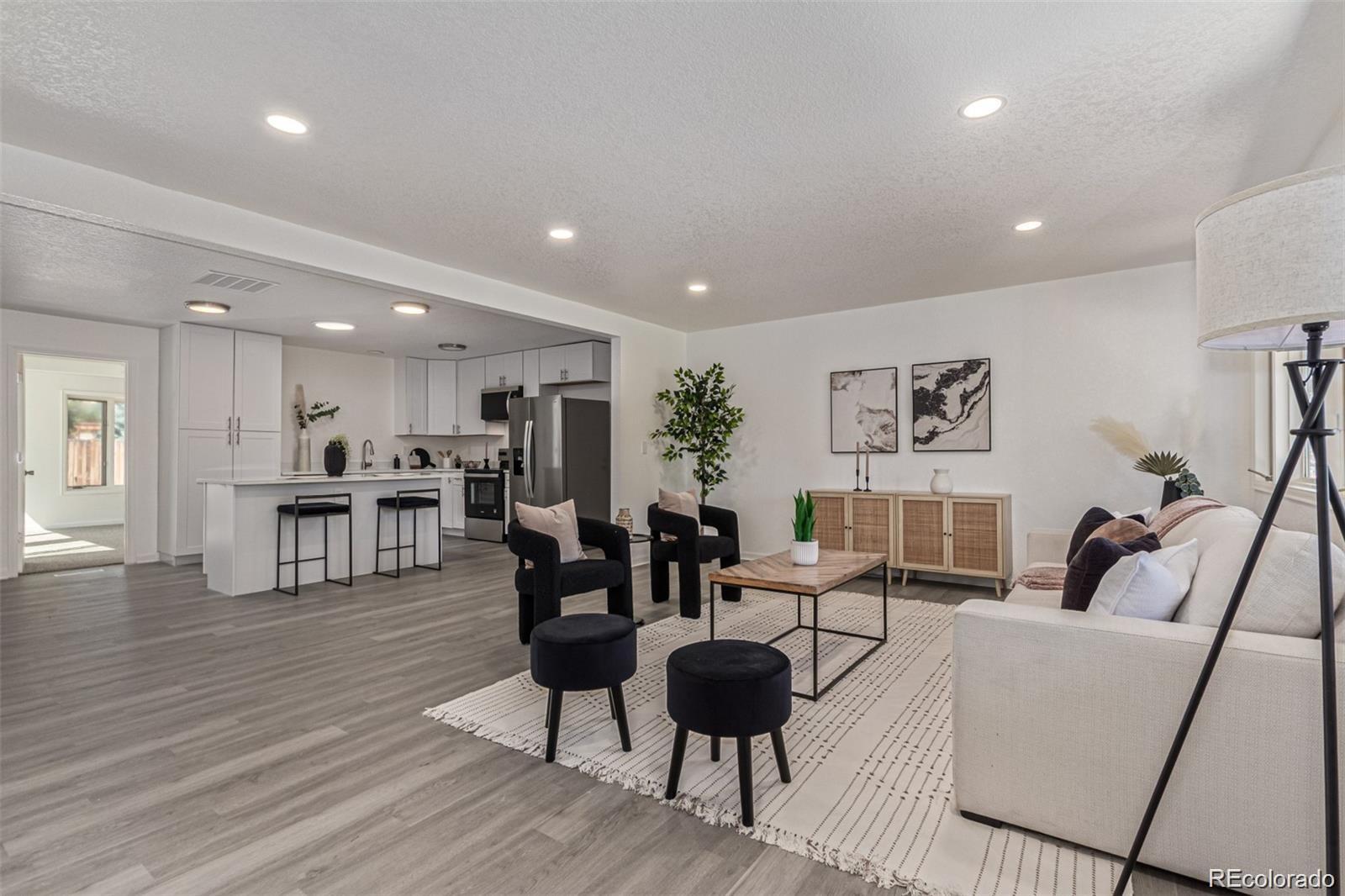 9495 Webster Way Broomfield, CO 80021 - Photo 2 of 32 a living room with furniture and wooden floor