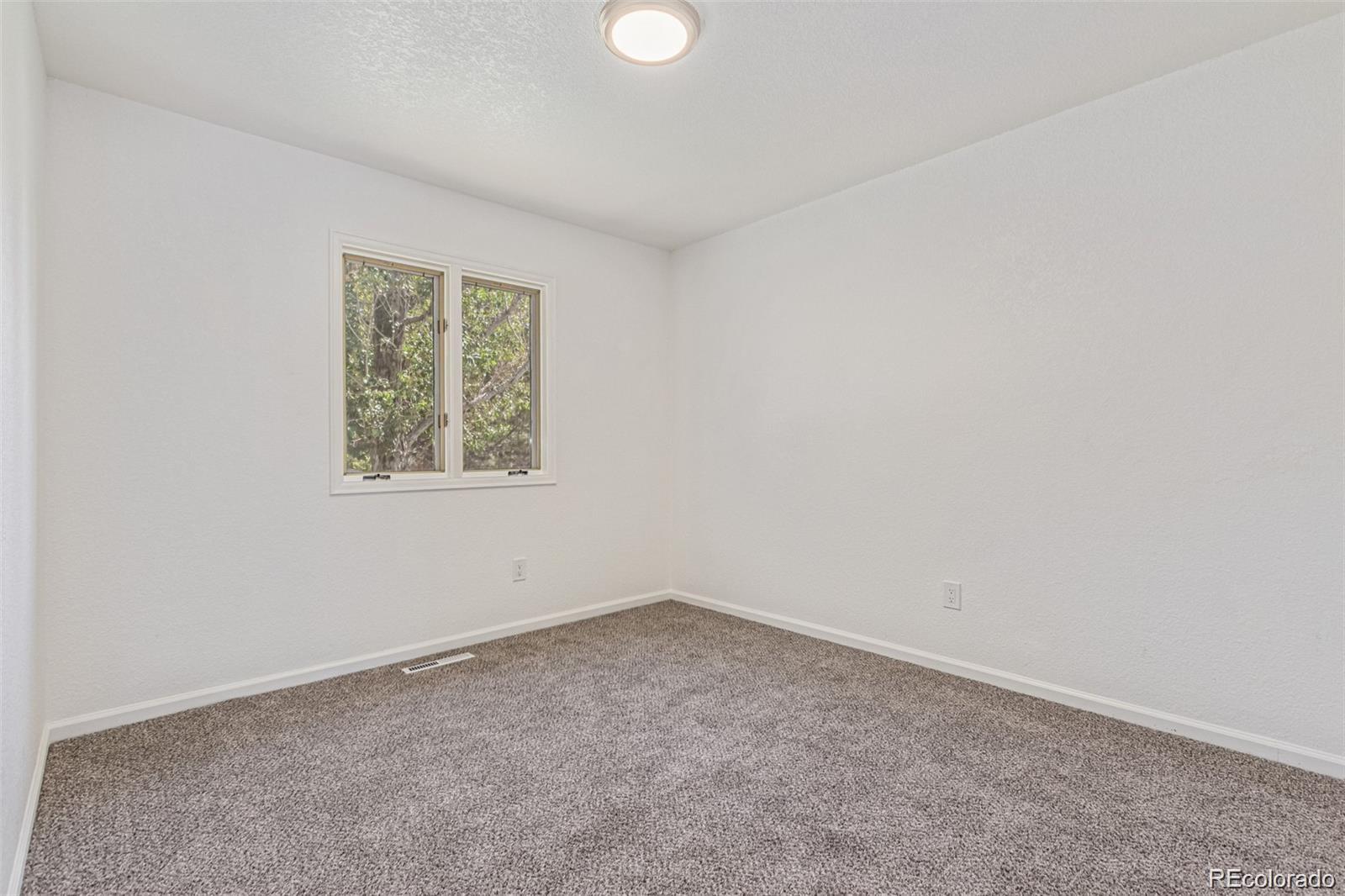 9495 Webster Way Broomfield, CO 80021 - Photo 22 of 32 an empty room with a window