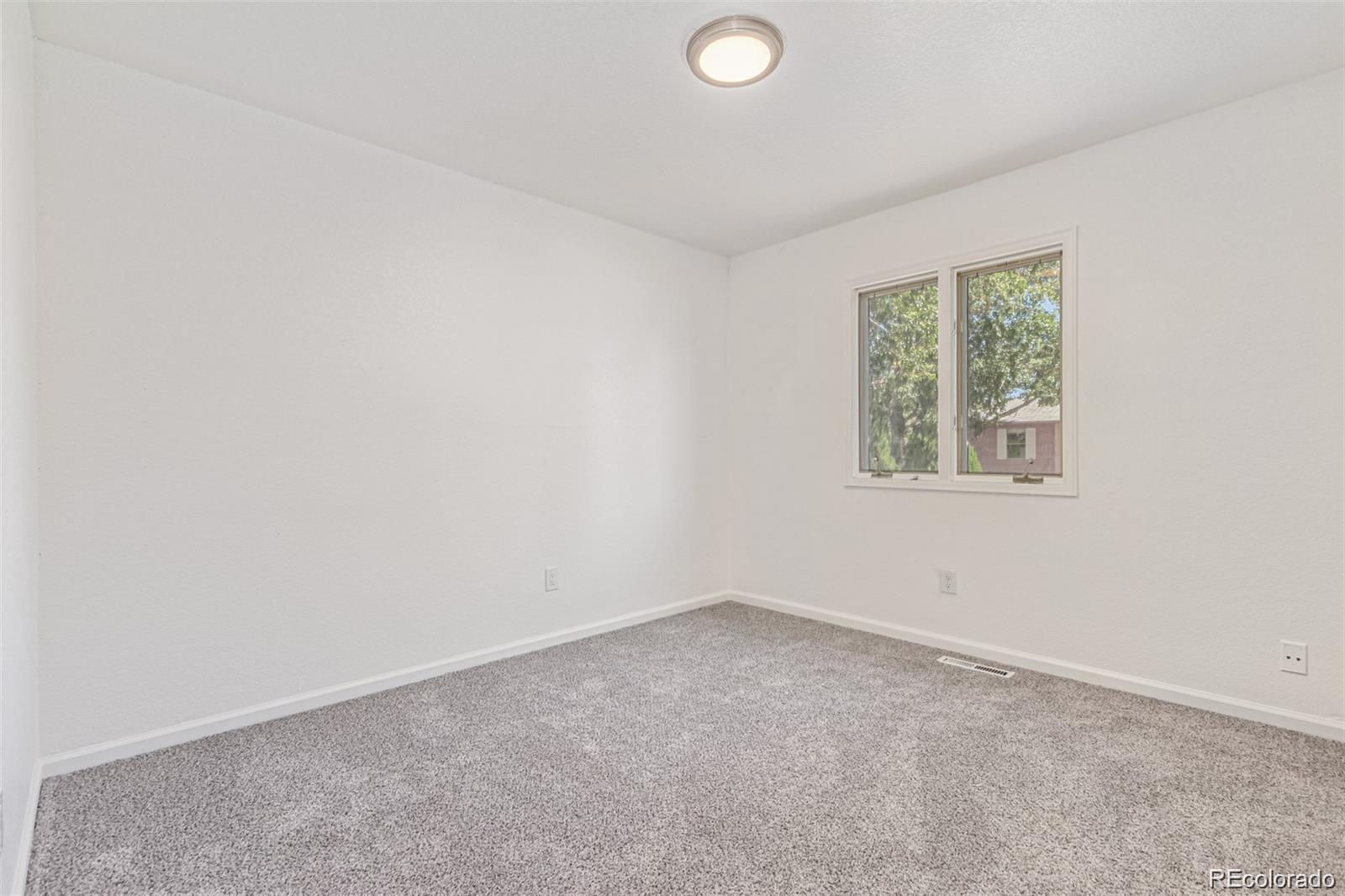 9495 Webster Way Broomfield, CO 80021 - Photo 24 of 32 an empty room with a window