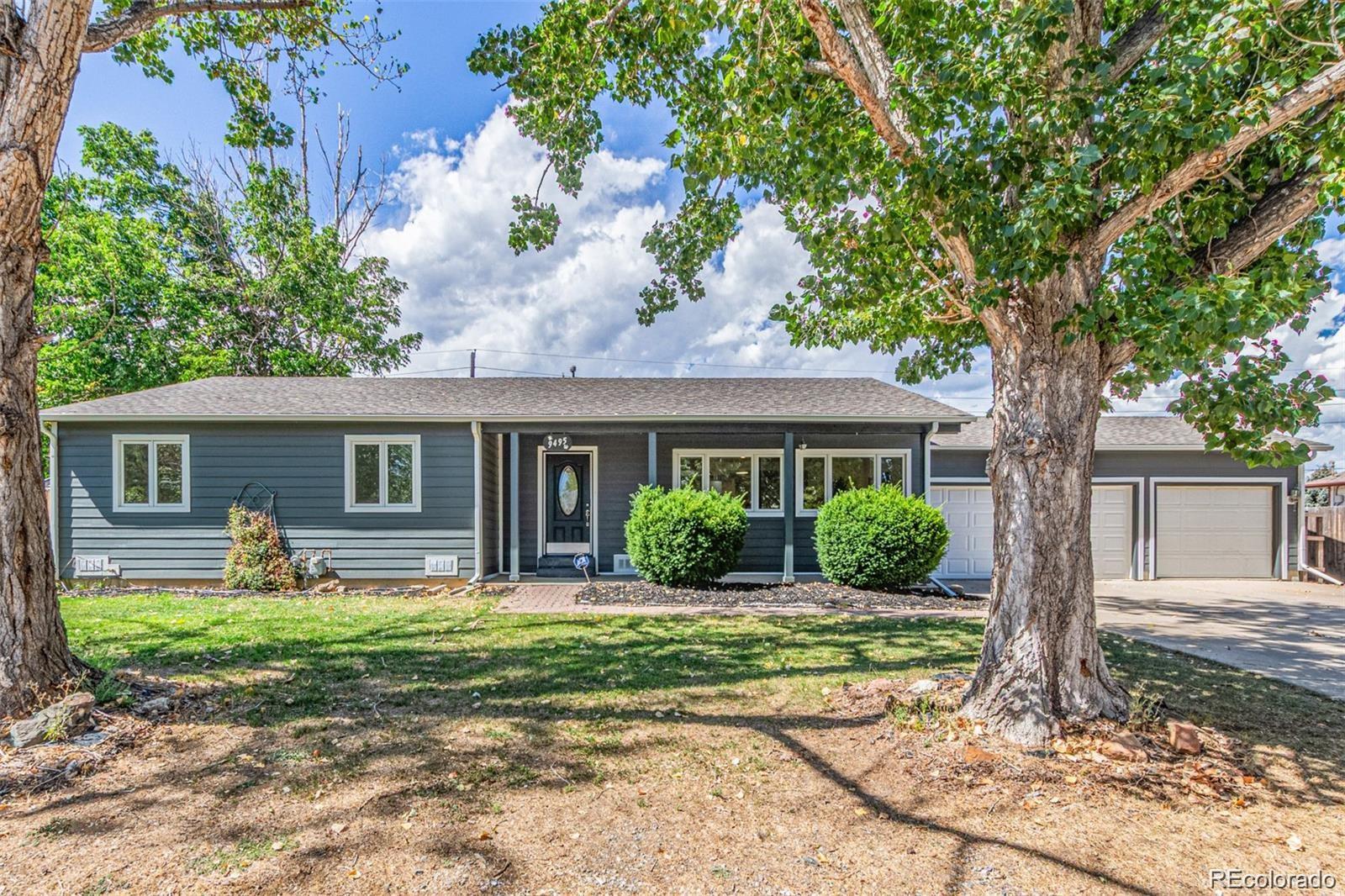 9495 Webster Way Broomfield, CO 80021 - Photo 4 of 32 front view of a house with a yard