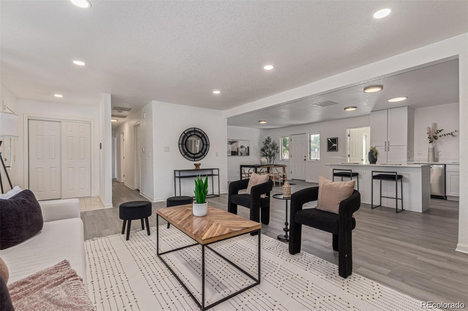 9495 Webster Way Broomfield, CO 80021 - Photo 9 of 32 a living room with furniture and a wooden floor