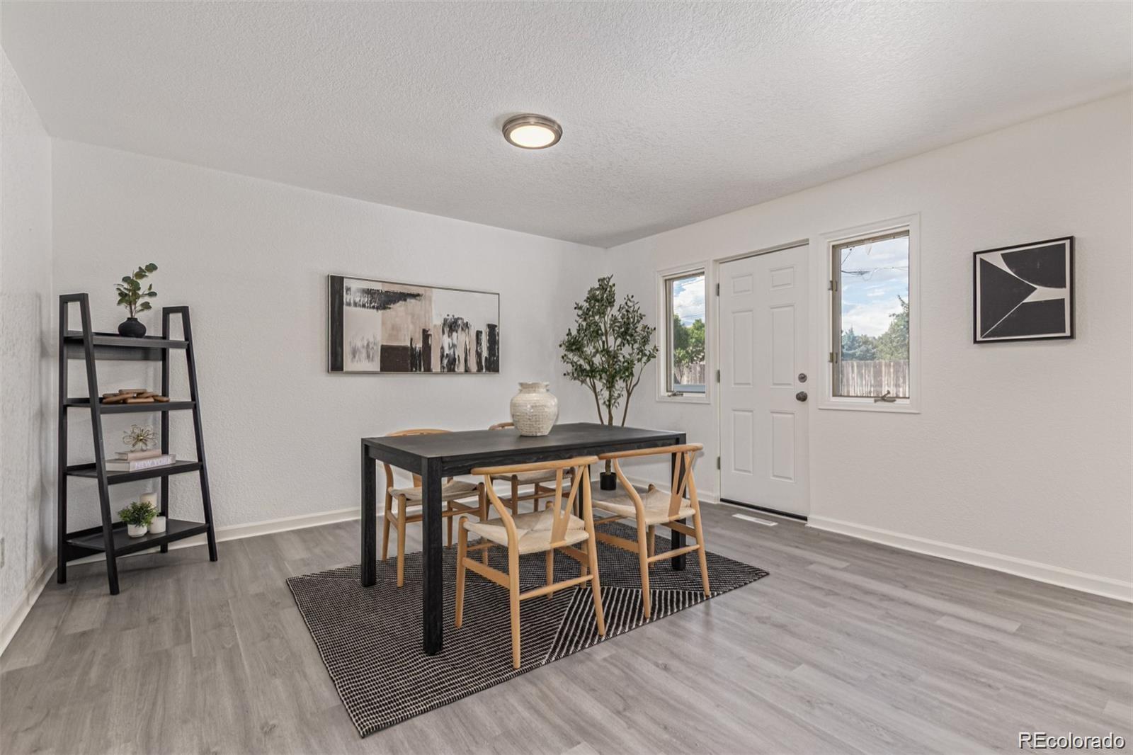 9495 Webster Way Broomfield, CO 80021 - Photo 10 of 32 a dining room with wooden floor and breakfast area