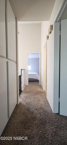 a spacious bedroom with a bed and a window