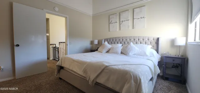 a bedroom with a bed and television