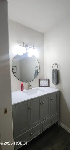 a bathroom with a sink and mirror