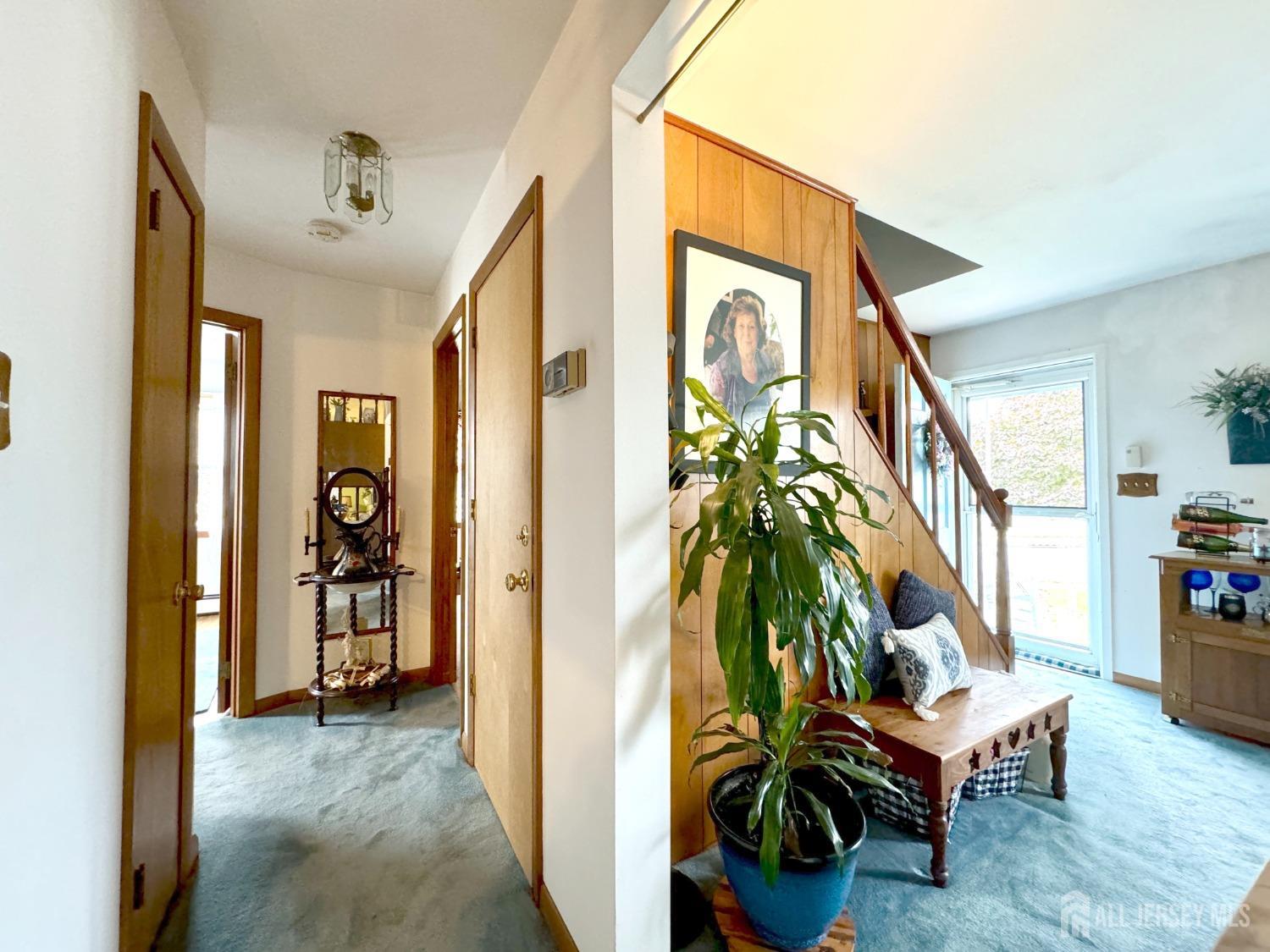 123 Crestview Road Fords, NJ 08863 - Photo 11 of 31 a view of an entryway with wooden floor and a livingroom