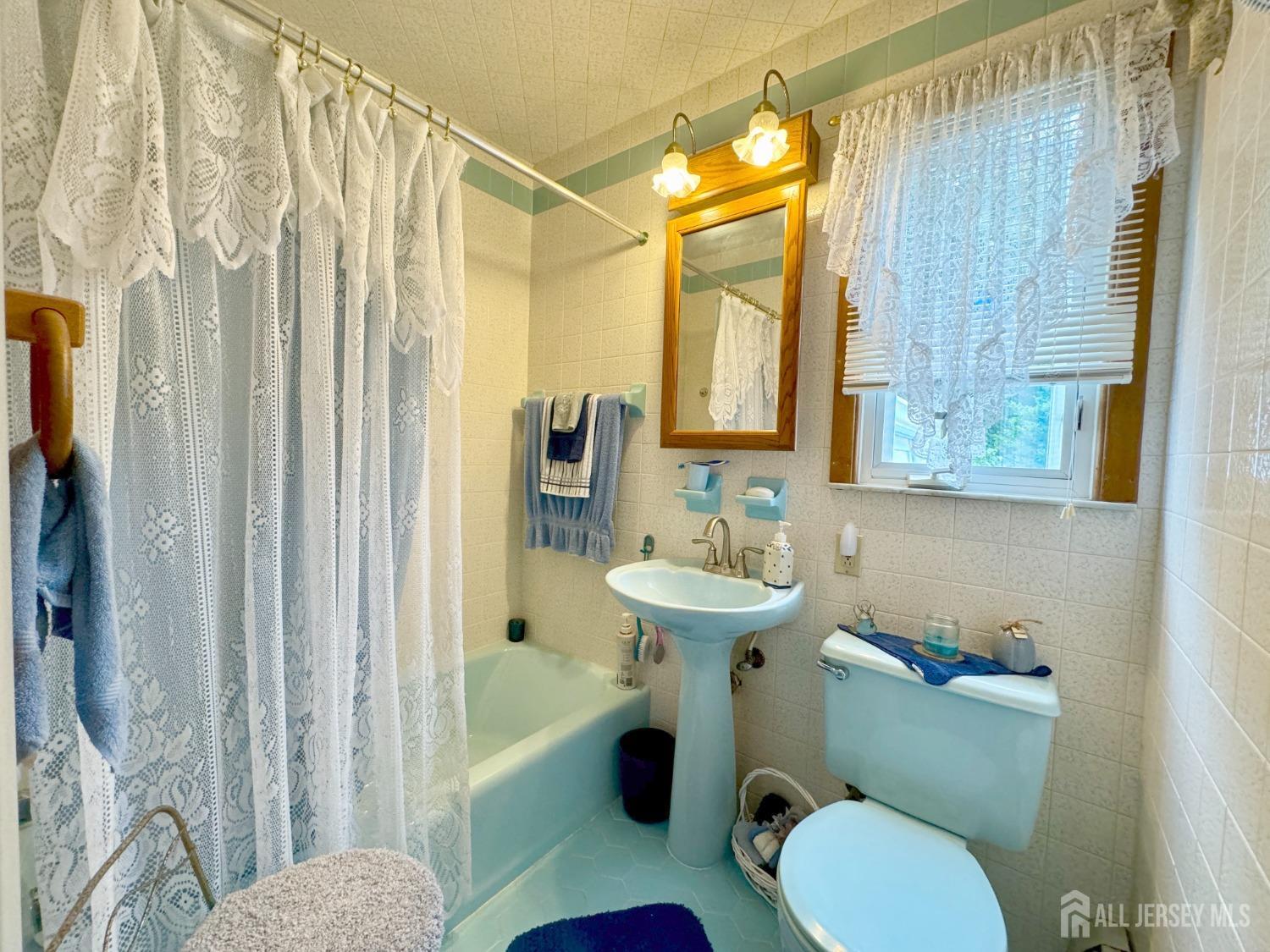 123 Crestview Road Fords, NJ 08863 - Photo 17 of 31 a bathroom with a sink toilet and shower