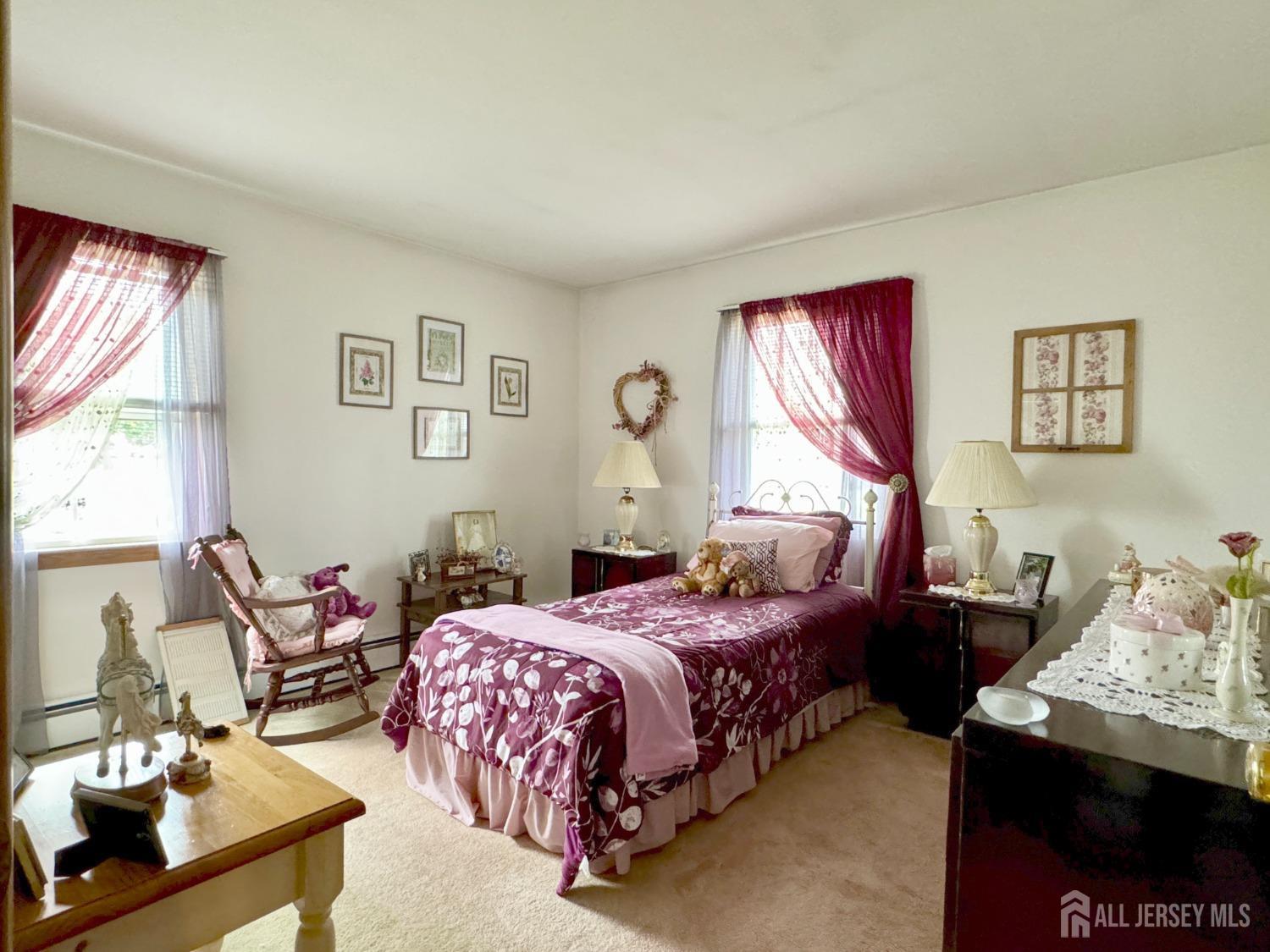 123 Crestview Road Fords, NJ 08863 - Photo 19 of 31 a bedroom with a bed and wooden floor