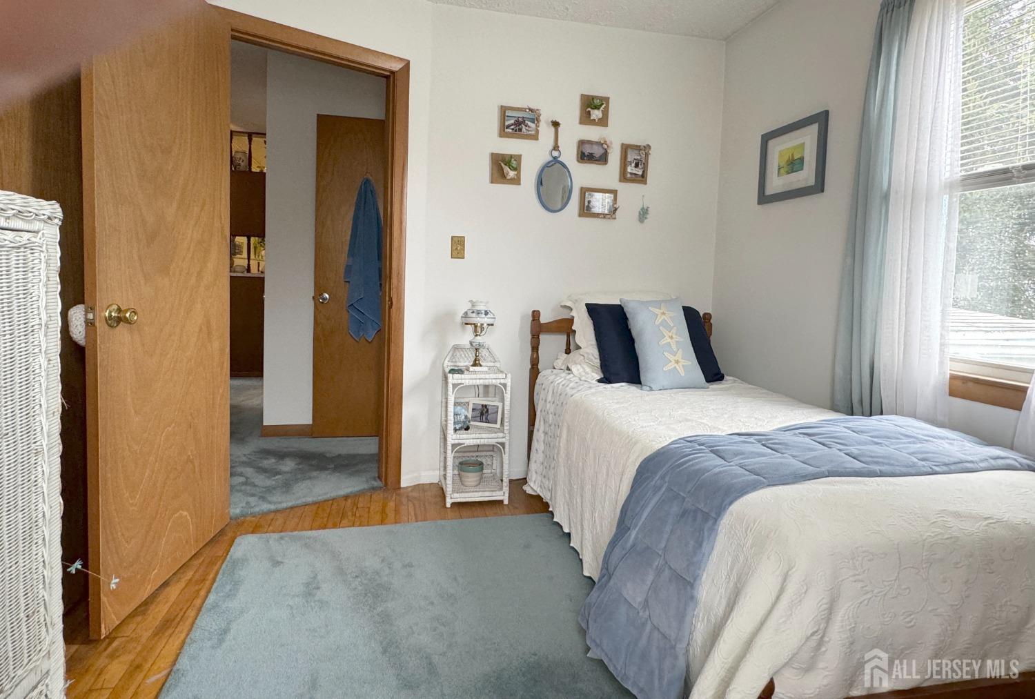 123 Crestview Road Fords, NJ 08863 - Photo 20 of 31 a bedroom with a bed and a window