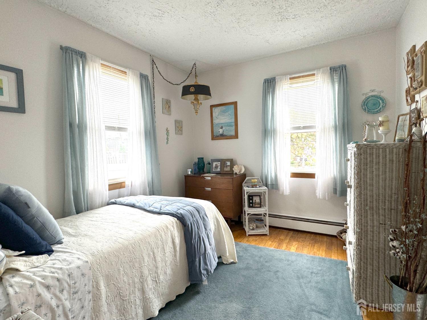 123 Crestview Road Fords, NJ 08863 - Photo 21 of 31 a bedroom with a bed and a window