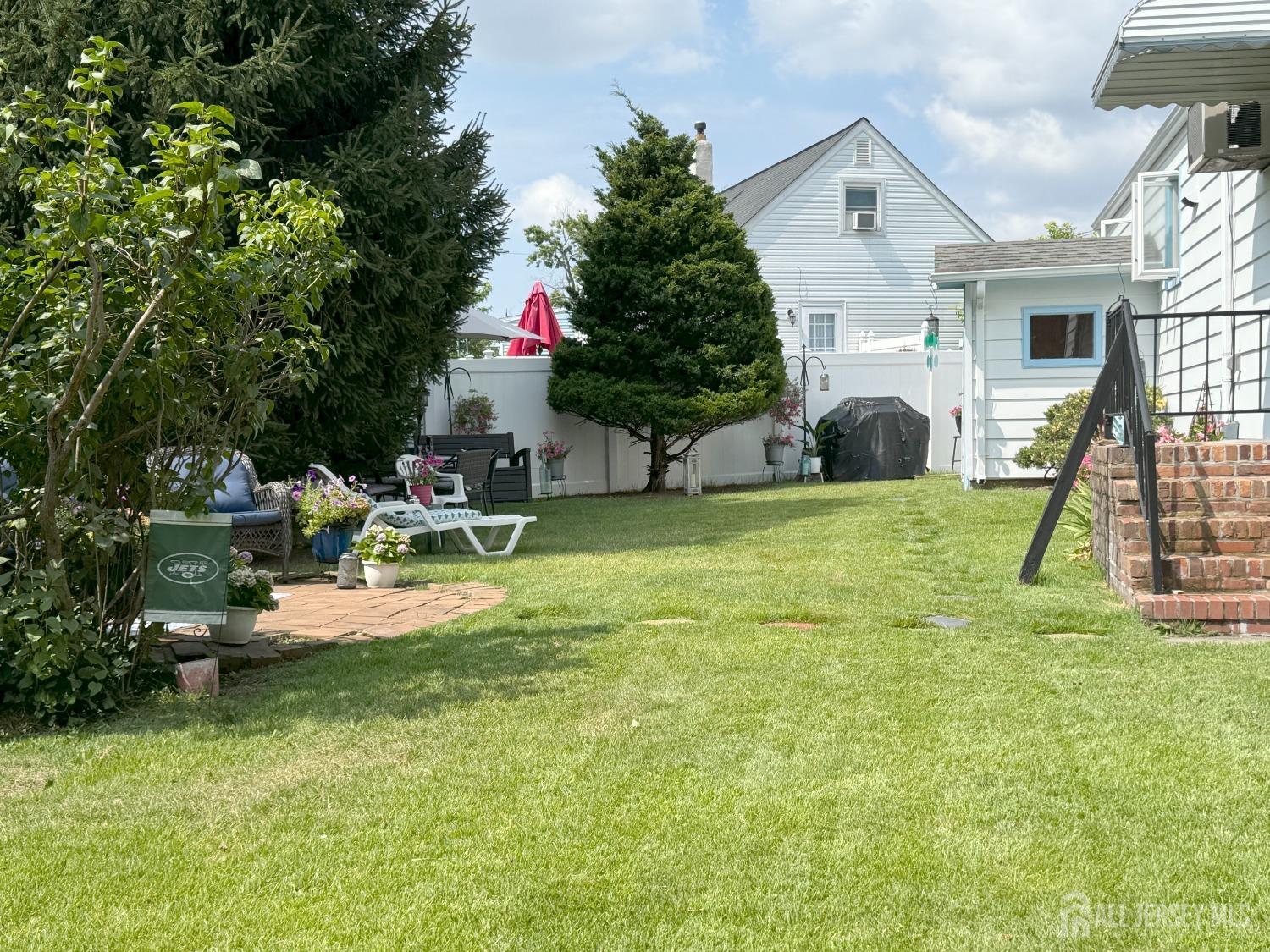 123 Crestview Road Fords, NJ 08863 - Photo 26 of 31 a view of a house with backyard and sitting area