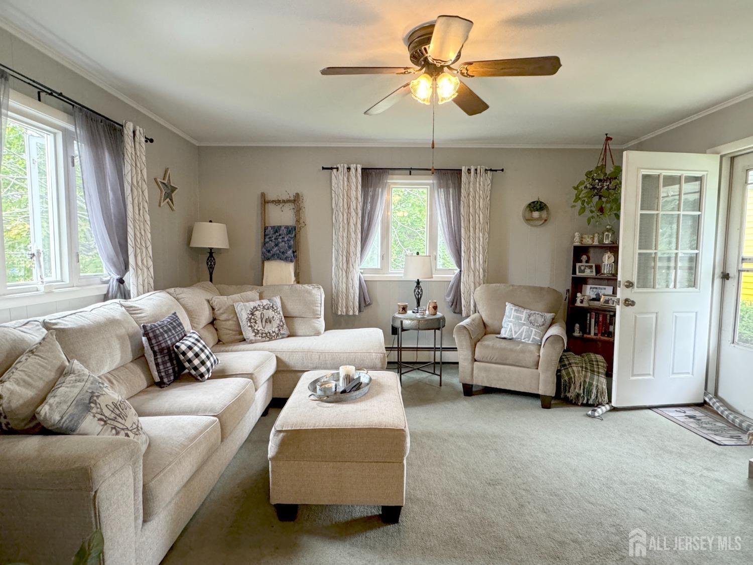 123 Crestview Road Fords, NJ 08863 - Photo 6 of 31 a living room with furniture and a large window