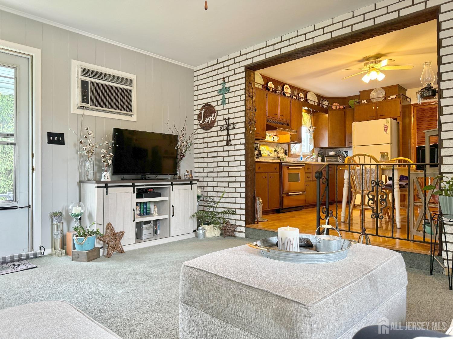 123 Crestview Road Fords, NJ 08863 - Photo 7 of 31 a living room with patio furniture and a flat screen tv