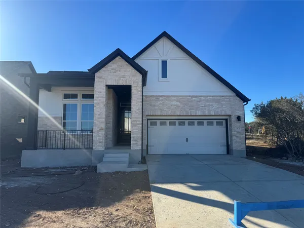 a front view of a house with a garage