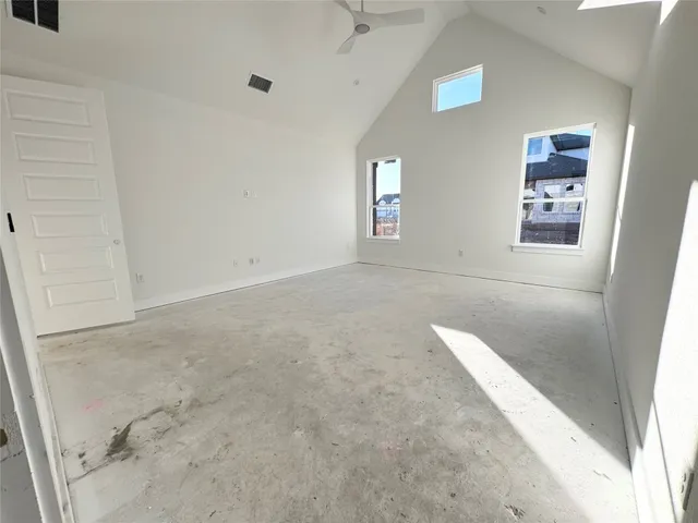 a kitchen with granite countertop a sink a stove and a window