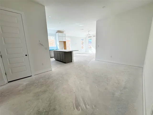 a view of an house with wooden floor and windows