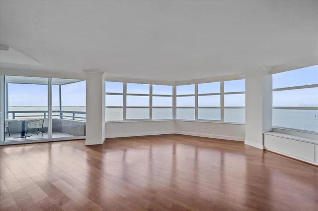 a living room with furniture and flowers