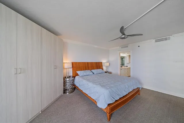 a bedroom with a bed and a cabinets