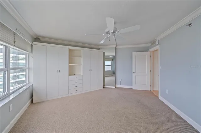 a spacious bathroom with a granite countertop sink a toilet a mirror and shower