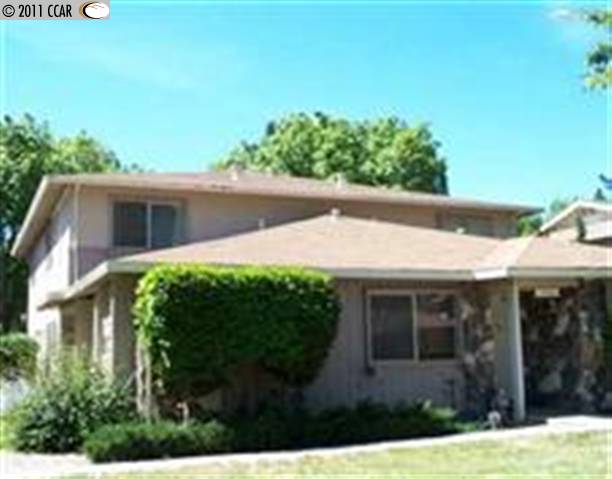 1446 Del Rio Circle, Unit C Concord, CA 94518 - Photo 1 of 1 a view of a house with a yard