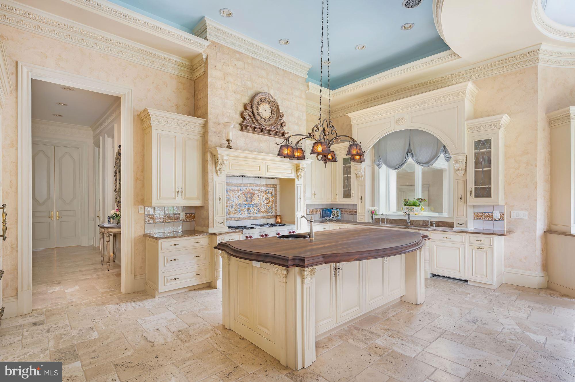 9300 River Road Potomac, MD 20854 - Photo 18 of 50 Cream Cabinetry and Versailles Pattern Flooring